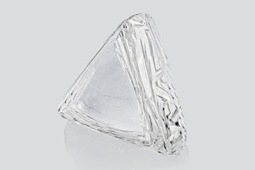 Transparent rough diamond isolated on white background