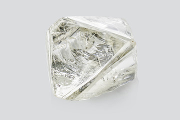 Transparent rough diamond isolated on white background