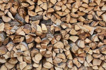 Pile of chopped birch firewood in remote Russian village