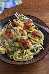 Spaghetti with spinach and chicken meatballs. Pasta with meatballs
