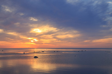 Fototapeta premium Baltic sea - early morning golden sunrise over the sea. Kurzeme, Latvia