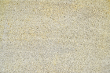 Fototapeta premium Pale yellow texture of concrete plastered wall