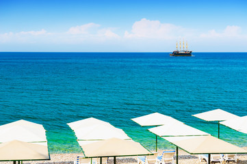 Fototapeta na wymiar Beautiful beach with blue sea in Kemer, Turkey.