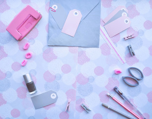 Stationery, badges, clothespins, bands, pink rose, nail polish, pens and pencils. Pink and gray mockup