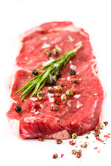 Raw beef steak ready to be cooked isolated on white background

