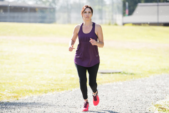 Active woman running outside