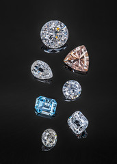 Colorful precious stones isolated on black background