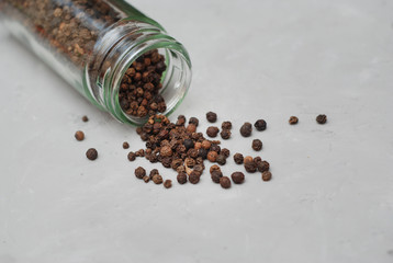 Peppercorn Whole Black Pepper Spices over Gray Textured Background. Food Ingredient.