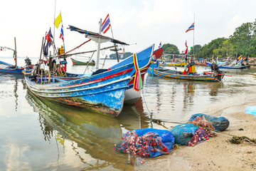 Colorfull Thailand fishing boats on a sea shore