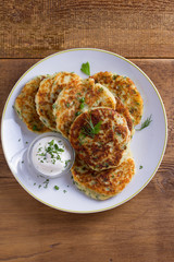 Herb and Cheese Mashed Potato Cakes. Potato Pancakes. Vegetable fritters. View from above, top studio shot