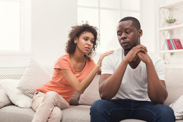 Fototapeta na wymiar Young black couple quarreling at home
