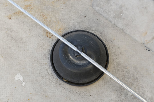 Plastic foot on the roof holding the wire of the lightning rod.