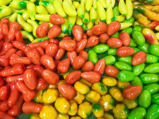 Well known Thai dessert in colorful Deletable imitation fruits,Mung beans paste in fruit-shaped and coated with jelly,Fruit Shaped Mung Beans call Kanom Look Choup in Thai.