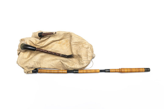 Traditional balkan bagpipe folk musical instrument. Isolated image on white background.