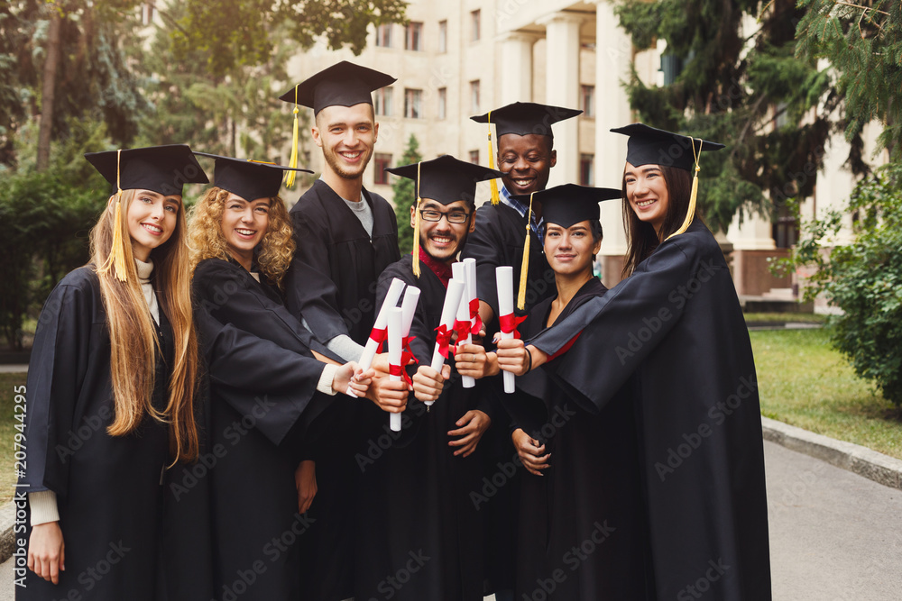 Poster Group of multiethnic graduates celebrating