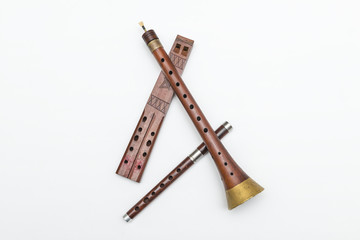 Zurla and wood flutes. Ancient serbian folk musical instruments on white background.