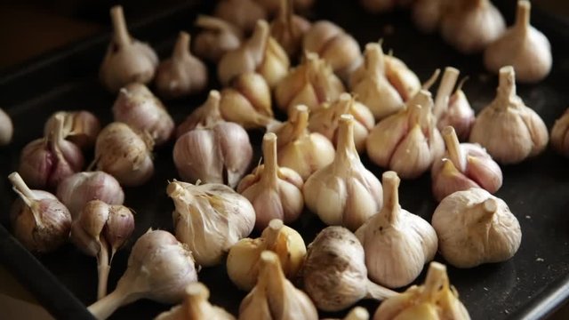 Fresh home-grown garlic  on a tray