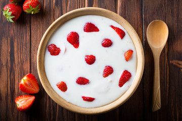 strawberry yoghurt cereals Wooden plate spoon Vintage background
