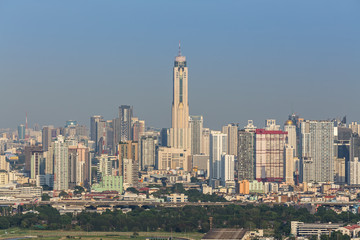 Aerial view of Bangkok modern office buildings, condominium in Bangkok city downtown with sunset , Bangkok , Thailand
