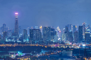 Aerial view of Bangkok modern office buildings, condominium in Bangkok city downtown at night, Bangkok , Thailand