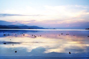 Sunset reflexions on flat sea surface. Wallpapper landscape image. © pirke