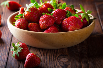 strawberry wooden plate spoon Vintage background
