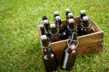 Wooden crate with unlabelled bottles of beer