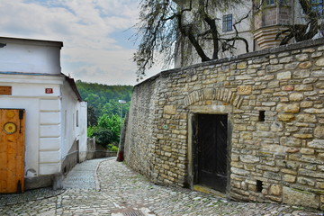 Fototapeta na wymiar Small Czech village. Narrow streets & brick walls. 