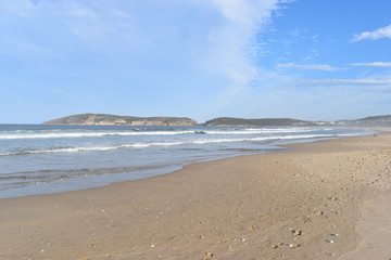 Fototapeta na wymiar Wonderful beach with Robberg Nature Reserve in background in Plettenberg Bay, South Africa