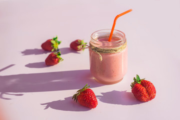 Sweet smoothies from strawberries on white background
