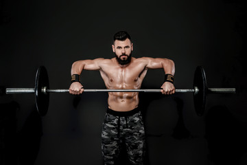 Fototapeta na wymiar muscular man workout with barbell .