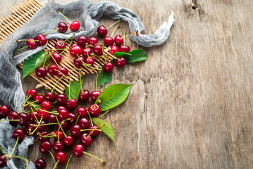 Fresh sweet cherries on wooden background. Top view. Copy space. Flatlay