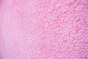 Bubblegum pink rough wall.