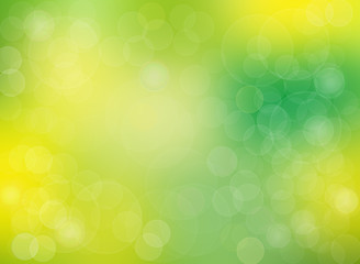 Abstract yellow light and green summer bokeh background.