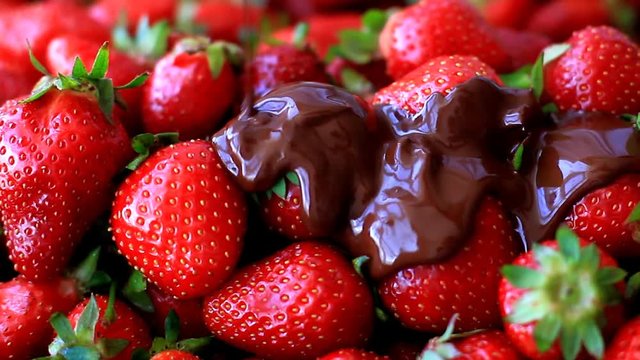 Strawberries watered with melted chocolate on top
