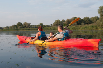 Family in a kayak on a water walk