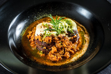 Tasty dish with beet and cheese on black