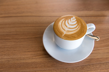 Flat white coffee on wooden table, Top view