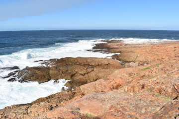 Fototapeta na wymiar Wonderful landscape with the blue beach at the hiking trail at Robberg Nature Reserve in Plettenberg Bay, South Africa