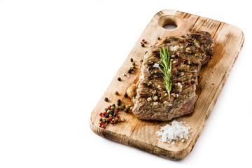 Grilled beef steak isolated on white background. Top view. Copyspace

