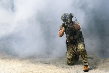 The military or soldier holding machine guns for ready to attack terrorists or bandits. with...