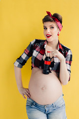 pregnant girl in the style of pin-up with a bottle of soda