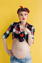 pregnant girl in the style of pin-up with a bottle of soda