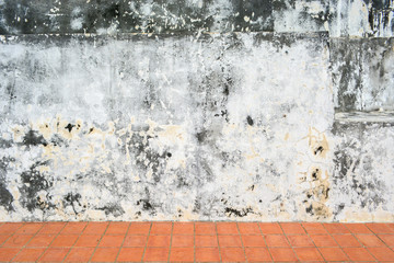 Old white wall with sloppy black streaks.