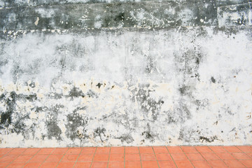 Old white wall with sloppy black streaks.