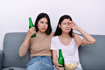 The concept of watching television. Asian girls watching television with different sensations.