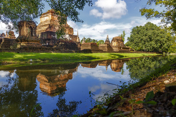 Fototapeta na wymiar Stupas and river at Sukhothai Historical Park Thailand