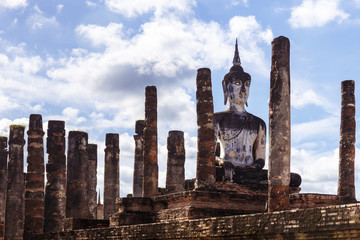 Buddha among columns in Sukhothai Historical Park in Thailand