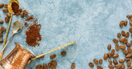 Copper pots, spoon and coffee beans.
