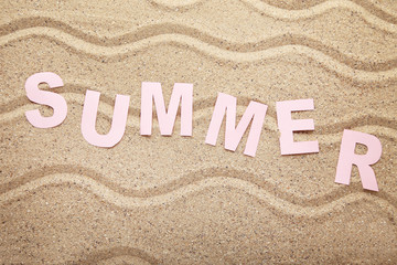 Inscription Summer on beach sand